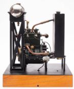 A scale model of a twin piston four stroke engine, 3 inch brass flywheel,