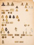 A collection of regimental badges,