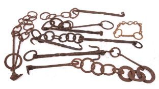 A collection of six iron pot hooks: with ring chains.