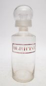 A castor oil pouring apothecary jar: inscribed in red to front 'OL. Ricini', 27cm high.