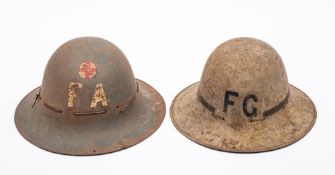 Two WWII period Zukerman steel civil defence helmets, one a Fire Guard helmet,