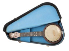 A Keech banjulele No. G9284 with 6 inch skin and mother of pearl dot fret markers, in case.