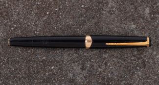 Montblanc. A Montblanc 22 fountain pen: black cap and barrel with gilt fittings.