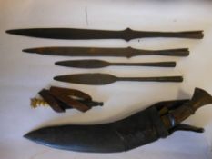 Four Naga Hills spearheads together with a kukri contained in a leather scabbard and a bone handled
