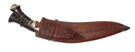 An ebony handled Kukri: in brown leather scabbard.