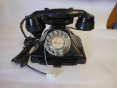 A model 232 bakelite telephone hand set: with integral drawer and braided handset cord. 23cm wide.