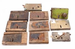 Two brass rimlocks, a steel rimlock and a group of wood cased iron rimlocks.