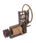 A French steel and brass spit jack: with triple brass wheels gripping the rope driven pulley.