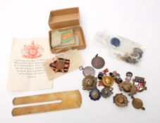 A WWII group of four in original postage box: together with a brass button polisher and a