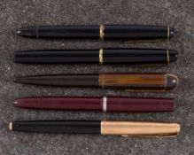 A Parker 61 fountain pen: gold cap and black barrel,