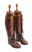 A pair of British Army Officer boots with laces and three leg buckles with original wood and brass