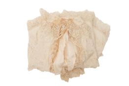 An early 20th century cream silk floral embroidered child's cape.