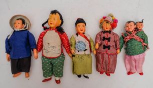 A group of five Chinese character dolls in traditional costumes,