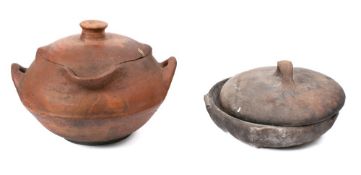 A terracotta twin-handled salting crock: of squat circular form with lipped body, 38cm across,