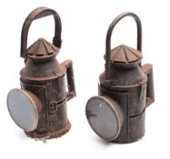 Two early 20th century railway hand signal lanterns each with original burners and two colour