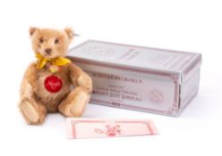A Steiff replica 1951 Music Teddy bear, circa 1993, Caramel plush with ear stud, glass eyes,