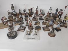 A collection of painted white metal and painted figures and vignettes in various scales from 1/35th