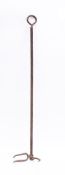 An adjustable iron flesh fork: with key end adjustable tine, 124cm long.