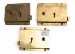 A pair of brass two lever rim locks: one stamped N F Ramsey, Newcastle,