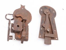 A 19th century iron church cupboard door lock: together with a steel spring latch (2) *Notes-