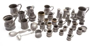 A collection of pewter measures, peppers and tankards: including four brass rimmed measures,