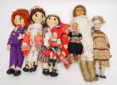 A collection of various dolls,