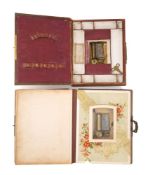 Two musical leather-bound photo albums.