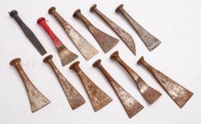 A group of twelve steel caulking tools: