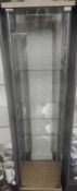 A two-door glazed display cabinet with four glass shelves 172cm high, 64.