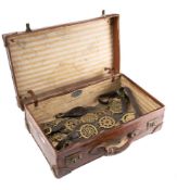 A collection of horse brasses including three martingales.