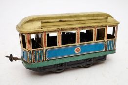 A Carette O gauge electric Tram car in cream blue and green,