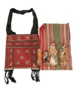 A group of four Bolivian cloth dolls in traditional costume, together with a poncho and bag.