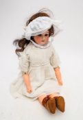An Armand Marseille bisque shoulder headed doll, applied wig, brown glass eyes,