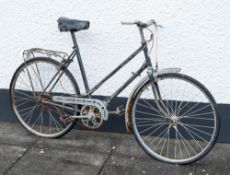 A BSA lady's bicycle: with black step through frame and cable brakes.