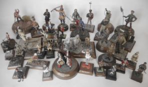 A collection of painted white metal and painted figures and vignettes in various scales from 1/35th