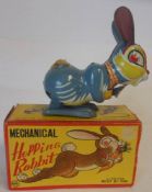 Line MAR Toys, a Japanese clockwork tinplate 'Hopping Rabbit' with lithographed detail, 14cm high,