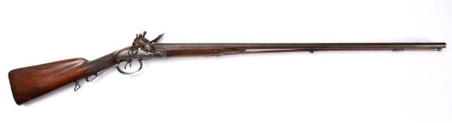 A 19th century double barrel flintlock shotgun,