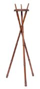 A 19th Century simulated bamboo tripod folding kettle or pot stand: with circular platform,