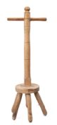 A turned beechwood and fruitwood washing dolly: with six legged base, 91.5cm high.