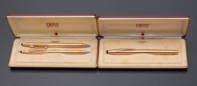 Two Cross gold plated ball pens and a 1505 rolller ball pen.