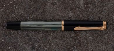 A Pelikan 400 fountain pen: 14c gold nib,