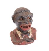 Cast iron figural money box with the hand feeding coins into the mouth: