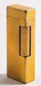 A Dunhill gilt Rollagas lighter with machined finish.