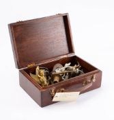 A collection of various brass and metal candle sconces and fittings, including a gilt brass cherub.