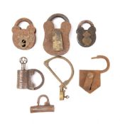 A group of seven various padlocks;