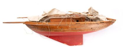 A 20th century model pond yacht: the simulated planked deck with cabin and fixtures and fittings