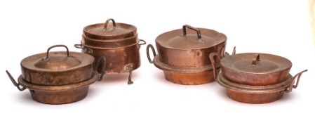 Three copper down-hearth circular cooking pots and covers: and a smaller twin-handled cooking pot