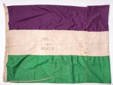 A 20th century flag stamped 'Votes For Women': in tricolour purple,
