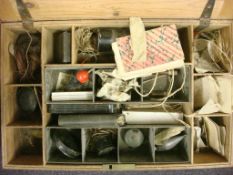 A collection of late 19th century fishing equipment in a pine box,
