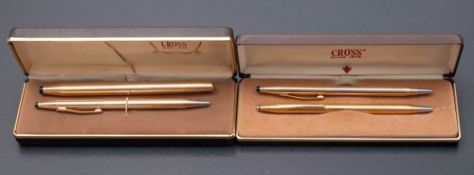 Three Cross gold plated ball pens and a 1505 rolller ball pen.